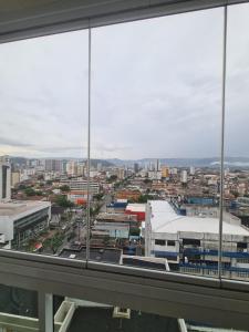 a view of a city from an office building at Apartamento Moderno 1 Quarto em Santos, Próximo à Praia e Comércio in Santos +15 photos