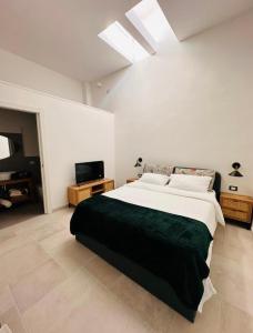 Ένα ή περισσότερα κρεβάτια σε δωμάτιο στο Ada&niní