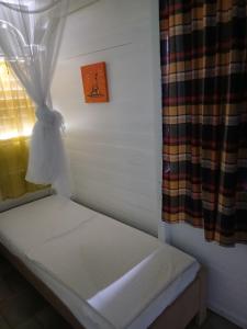 Postel nebo postele na pokoji v ubytování Le Jardin de Massieux