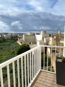 a balcony with a view of a city at St Therese in Victoria