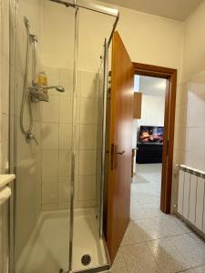 a shower with a glass door in a bathroom at Residenza Anagnina in Rome +20 photos