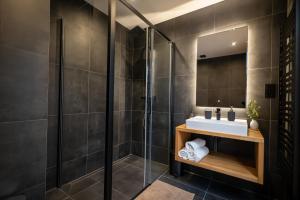 a bathroom with a sink and a shower at Apartmány Horizont in Loučná pod Klínovcem +84 photos