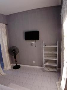 Et tv og/eller underholdning på Résidence hibis chez M&B