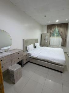 En eller flere senge i et værelse på رايز النسيم للشقق المخدومة