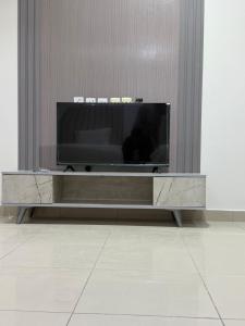 Et tv og/eller underholdning på رايز النسيم للشقق المخدومة + 23 billeder