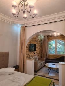 a living room with a couch and a table at Appartement Domaine Du Soleil Hammamet  +48 photos