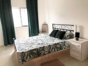 En eller flere senge i et værelse på Casa Dimaria