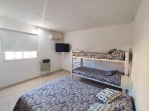 En eller flere senge i et værelse på Gotas de Rocio N1