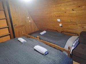 Postel nebo postele na pokoji v ubytování Vikendica Vedran Jahorina