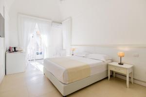 Postel nebo postele na pokoji v ubytování Dimora Margherita