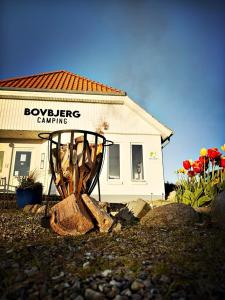 a building with a sign that says boykergency camping at Bovbjerg Camping in Lemvig +15 photos
