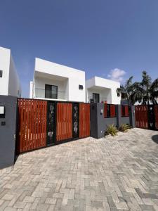 a gate in front of a house at DjossayaHomes in North Legon