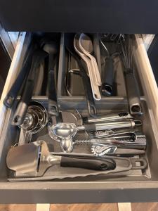 a drawer full of kitchen utensils in a box at Apartment Alakorkalo in Rovaniemi