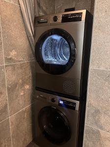 a washing machine and a dryer in a room at Apartment Alakorkalo in Rovaniemi
