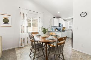 a kitchen and dining room with a table and chairs at Caldwell Ruby Tuesday! 60's Inspired comfort 3B2B in Caldwell +28 photos