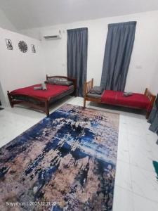 En eller flere senge i et værelse på Moksu Garden Tiny House jerteh