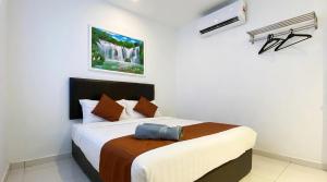 En eller flere senge i et værelse på Hotel Double Star Klia