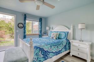 En eller flere senge i et værelse på Beachy Keen