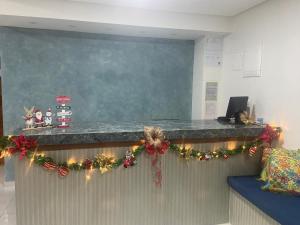 a classroom with christmas wreaths on a counter at Hotel Pousada Velas ao Mar in Maceió
