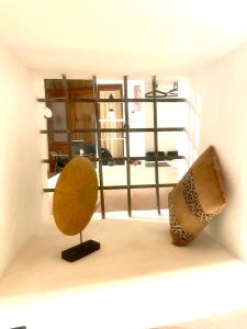 a room with two pieces of art on display at Casa "La Fonte" in Spoleto +16 photos