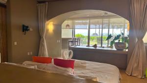 a bedroom with a bed and a large mirror at Perfect Hideaway for Two-GroundFloor in La Majahua