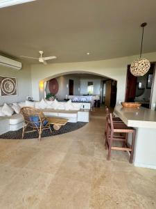 a living room with a couch and a table at Perfect Hideaway for Two-GroundFloor in La Majahua +19 photos