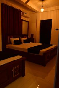 Postel nebo postele na pokoji v ubytování Lakmee Villa