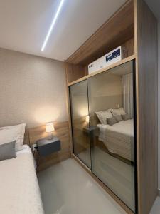 En eller flere senge i et værelse på Lindo Loft Studio no Centro de Curitiba