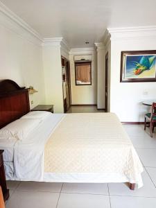 Postel nebo postele na pokoji v ubytování Hotel ASTURIAS BOUTIQUE