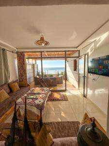 a living room with a view of the ocean at Deluxe Apartment At Amouage Anza in Agadir
