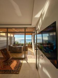 a living room with a view of the ocean at Deluxe Apartment At Amouage Anza in Agadir +25 photos