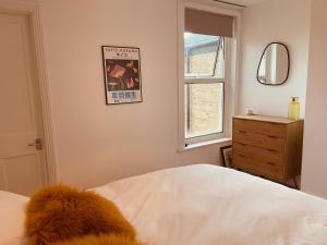 En eller flere senge i et værelse på Seal Cottage