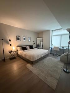 a bedroom with a large bed and a large window at SuCasa in Arlington
