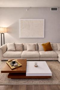 a living room with a couch and a coffee table at SuCasa in Arlington