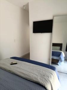 Postel nebo postele na pokoji v ubytování Casa Praia - Caraguatatuba e São Sebastião