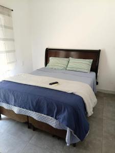 Postel nebo postele na pokoji v ubytování Casa Praia - Caraguatatuba e São Sebastião