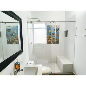 a bathroom with a shower and a toilet and a sink at Posada Campestre en Doradal in Puerto Triunfo