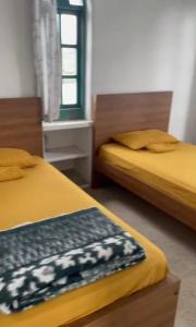 Postel nebo postele na pokoji v ubytování Teos Harmony Center + 6 fotografií