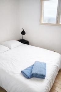 Postel nebo postele na pokoji v ubytování Appartement Vue mer La Croix Valmer