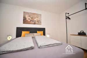 Ένα ή περισσότερα κρεβάτια σε δωμάτιο στο B & A Apartment mit Balkon