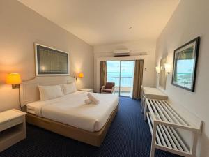 En eller flere senge i et værelse på Penang Rainbow Paradise