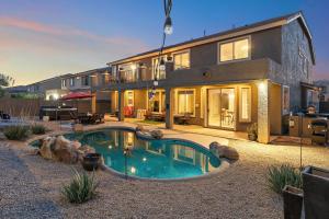 a house with a swimming pool in front of it at Sleeps 14 Pool Fire Pit Billiards EV Plug in Mesa