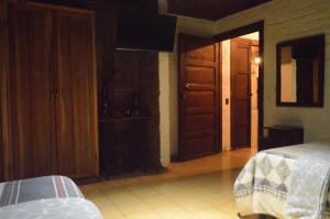 En eller flere senge i et værelse på Hostal y Restaurante Chilltepe Ataco