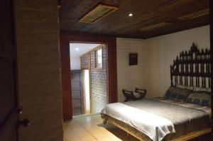 En eller flere senge i et værelse på Hostal y Restaurante Chilltepe Ataco + 9 billeder