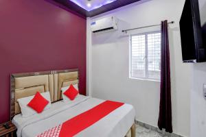 Ένα ή περισσότερα κρεβάτια σε δωμάτιο στο Hotel O SS hotel