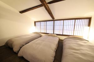 Llit o llits en una habitació de 水と翠