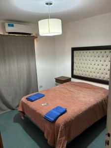 Giường trong phòng chung tại Ubicación inmejorable