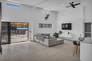 a living room with a couch and a table at Tathra Bermagui Road 613 in Tathra