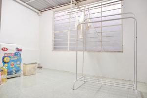 a white room with a window with blinds at KUHA home in Nha Trang +25 photos