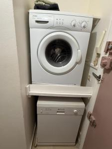 a washer and dryer in a small room at Brise Marine Sxm in Marigot +5 photos